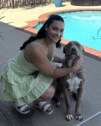 La Verne vet assistant Bella with a dog representing compassionate veterinary care in the La Verne area