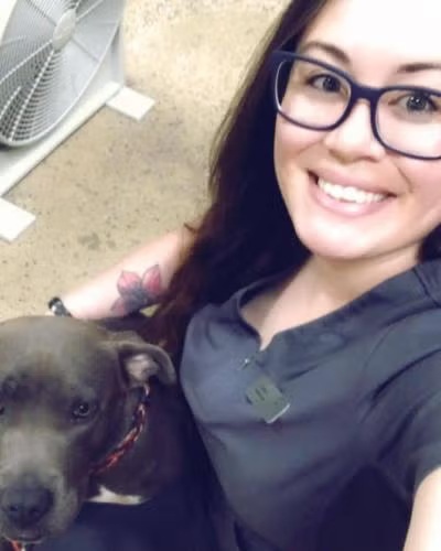 La Verne vet technician Cristina with a dog showing compassionate pet care at Pet Depot Veterinary Group 