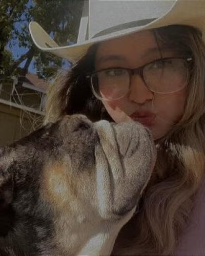 Veterinary assistant Krystal with dog compassionate veterinary care in the La Verne area 